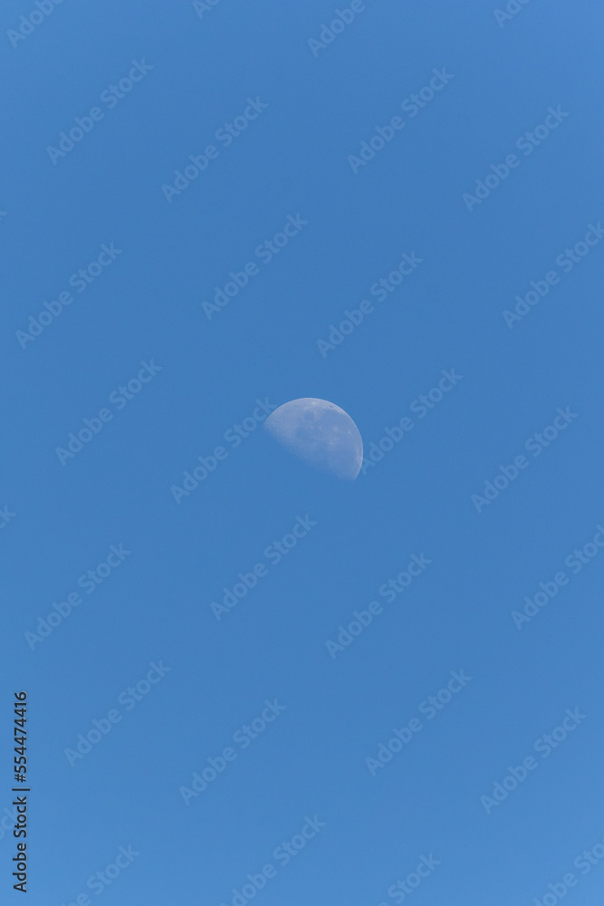 The waning moon in a blue sky. Nature. The waning moon in a blue sky. Nature.