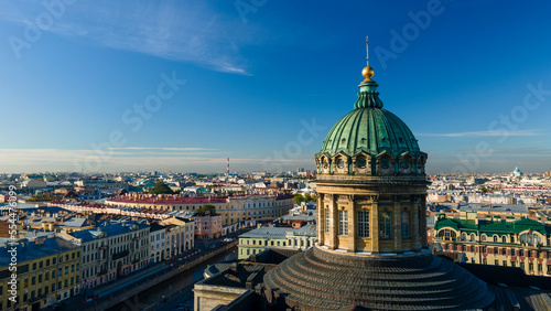 Aerial front, up view of the dome and colonnade of the Kazan Cathedral in the historical city of St. Petersburg at sunny summer dawn