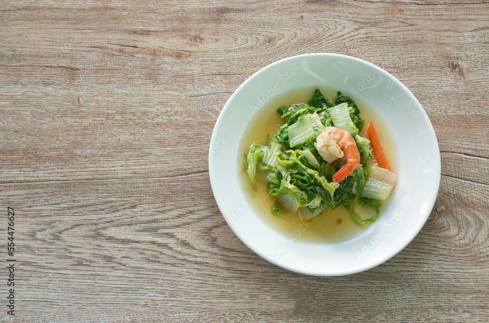 stir fried slice green Chinese cabbage and carrot with shrimp on plate stir fried slice green Chinese cabbage and carrot with shrimp on plate