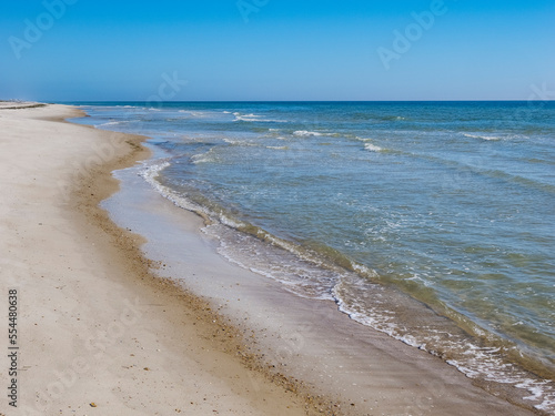 Calm blue sky summer  day on the Gulf of Mexico beach on St George Island in the panhandle or Forgotten Coast area of Florida in the United States photo