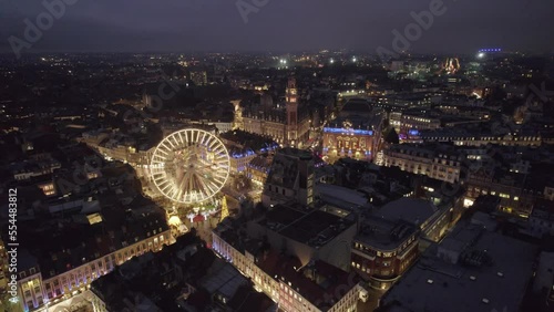 Aerial drone view of Lille, France, at Christmas by night. Amazing 4K video, panoramic view of cityscape photo