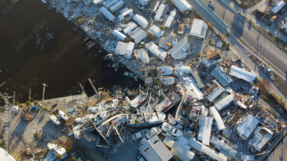 Fishing boats were pushed onto land by the historic storm surge from Hurricane Ian.