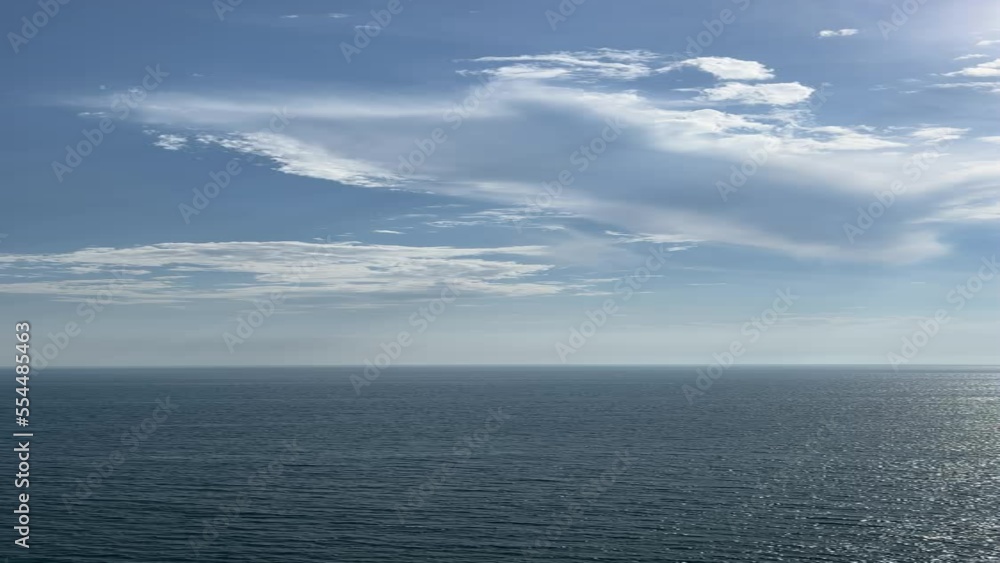 Sea shiny water and blue sky with clouds on horizon, beautiful seascape at summer. Sea shiny water and blue sky with clouds on horizon, beautiful seascape at summer.