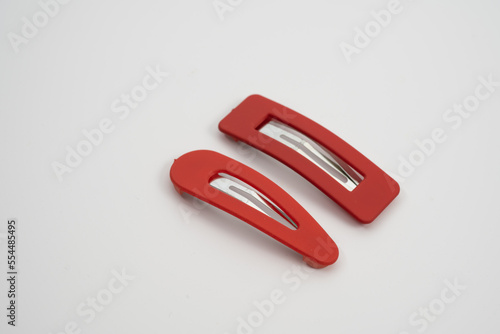 set of two red hair grips slides styles isolated on a white background