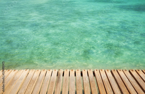 Wooden pier boards at a sea, selective focus, copy space.
