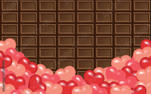 ピンクや赤色の沢山のハートと板チョコ