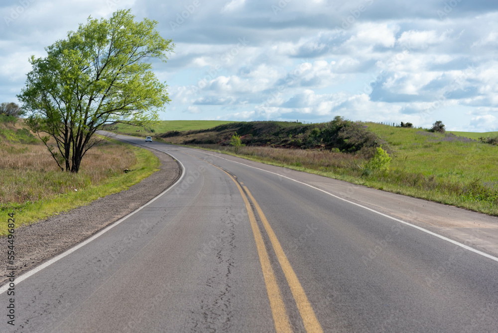 Fototapeta premium Highway cutting through rural landscape