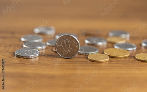 Coins on the wooden background