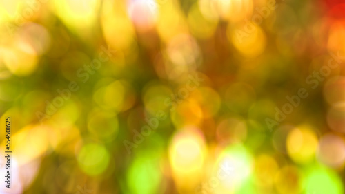 light yellow blurred bokeh of christmas tree decoration