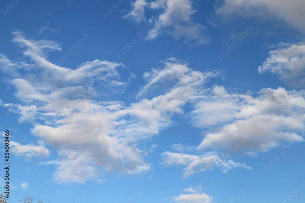 Fototapeta premium Thunderclouds against the blue sky. Template for wallpaper, stretch ceilings