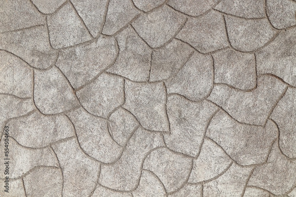 Rough cement plaster imitating stones on the wall close-up. High resolution photo. Rough cement plaster imitating stones on the wall close-up. High resolution photo.