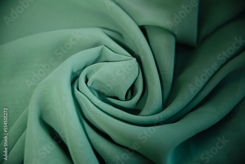 Turquoise knitted fabric. Sewing material .