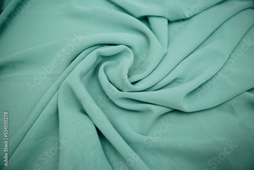 Turquoise knitted fabric. Sewing material .