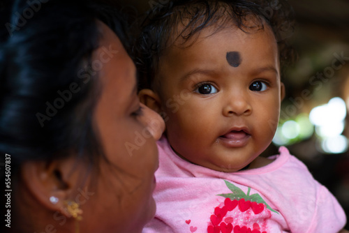 Fototapeta Portrait of happy mother with her cute baby