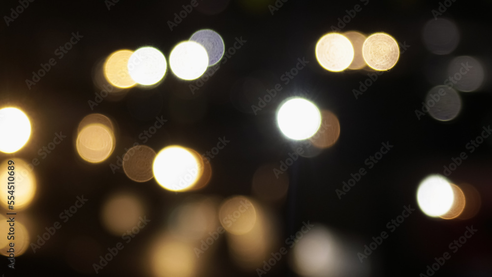 Blurred defocused image of evening car traffic in a big city. Cars in motion and standing in traffic jams. Long exposure exposure and headlight trails Blurred defocused image of evening car traffic in a big city. Cars in motion and standing in traffic jams. Long exposure exposure and headlight trails