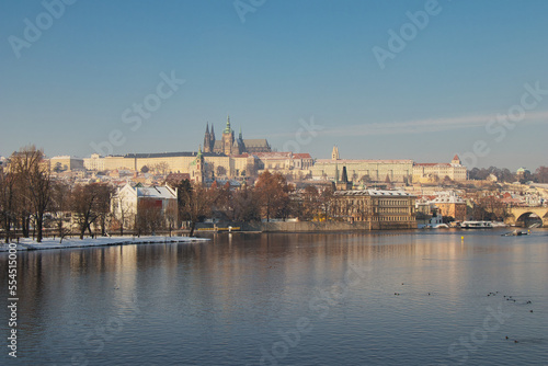 View over Vltava river to Charles bridge, Prague Castle in background.