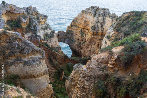 Dramatic view of a rugged Atlantic ocean coastline in Portugal Algarve Region © andreiorlov