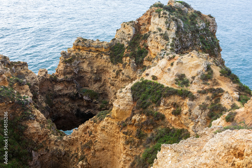 Dramatic view of a rugged Atlantic ocean coastline in Portugal Algarve Region © andreiorlov