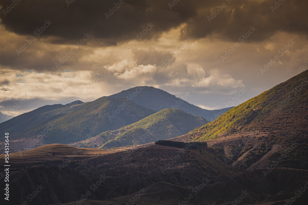 Obraz premium mountain view at sunset autumn sun rays