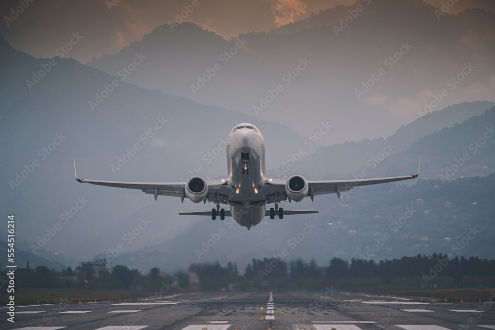 passenger plane takes off front view against passenger plane takes off front view against