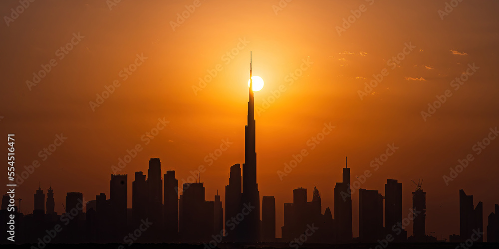 7th Oct 2022 - Dubai, UAE: Panoramic silhouette view of Dubai skylines and Burj Khalifa during the golden sunset hour