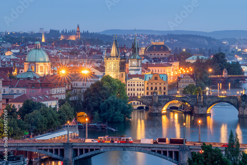 Scenic spring blue hour view of the Old Town pier architecture and Charles Bridge over Vltava river in Prague, Czech Republic