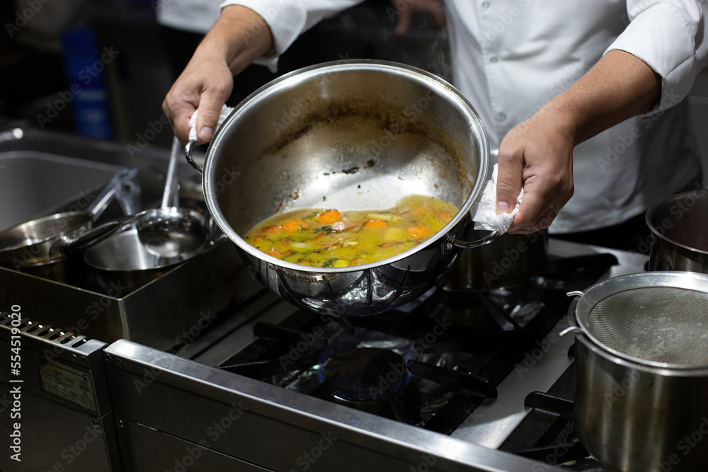 Vegetables in pots in the kitchen. Steel pots Stock Photo Adobe Stock