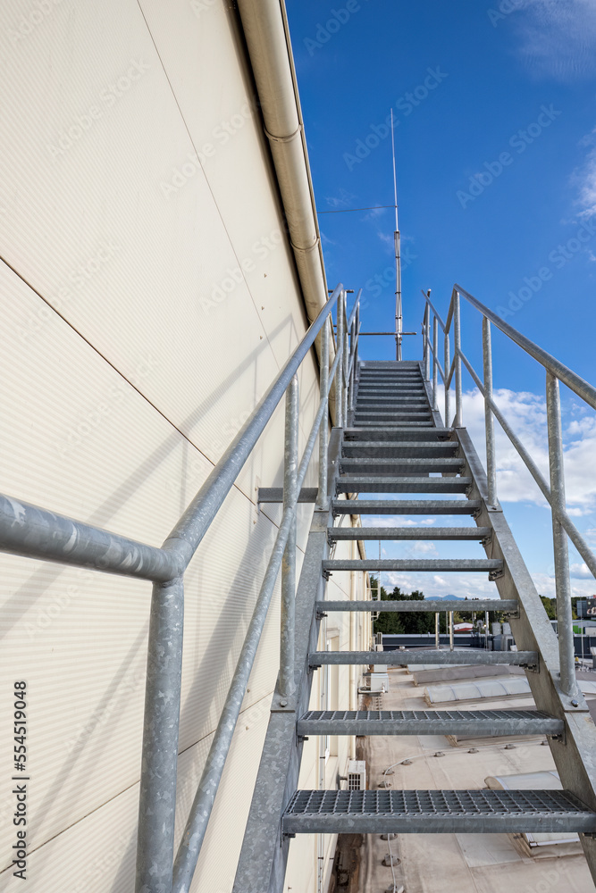 Fototapeta premium View of the galvanised stairs leading up to the roof.