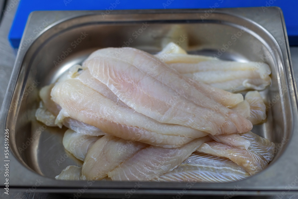 Sole prepared for cooking. Fish in the kitchen tub Sole prepared for cooking. Fish in the kitchen tub