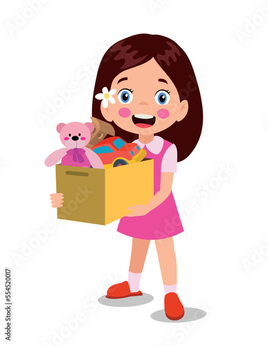 cute boy picking up his toys in the toy box