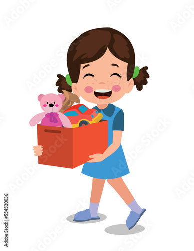 cute boy picking up his toys in the toy box