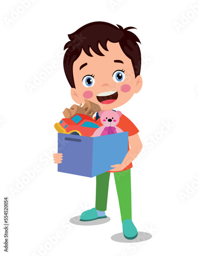 cute boy picking up his toys in the toy box