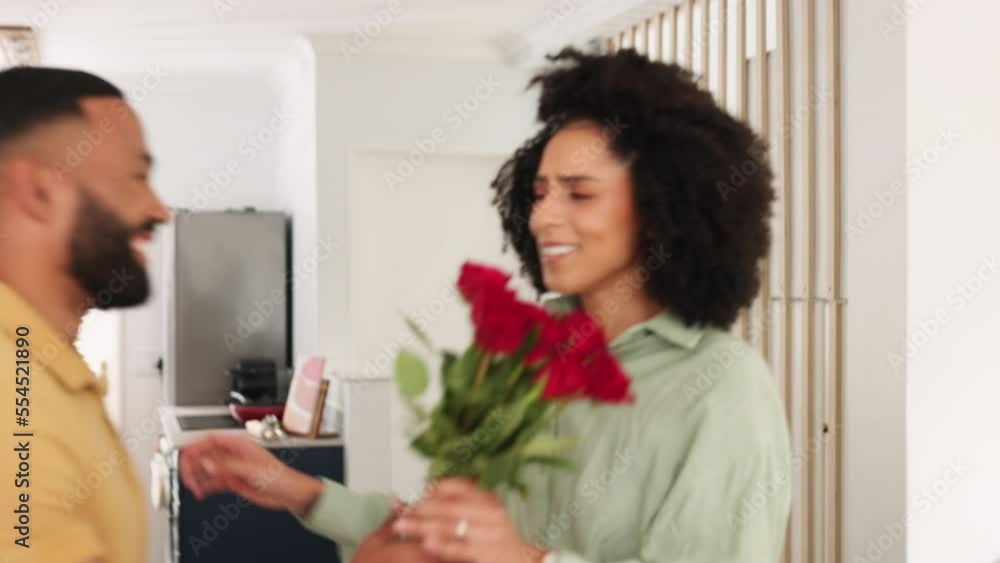 Flowers, anniversary and man with a surprise for his wife with love, romance and care at their home. Happy, smile and romantic husband with roses for celebration hugging a woman in the living room. Flowers, anniversary and man with a surprise for his wife with love, romance and care at their home. Happy, smile and romantic husband with roses for celebration hugging a woman in the living room.