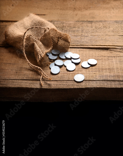 Tela Thirty coins in a bag on the table