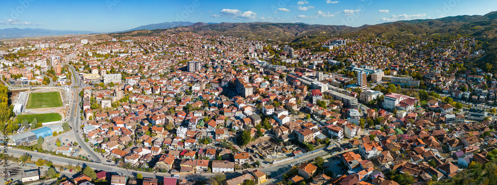 Aerial view around the city Shtip in North Macedonia on a sunny day in fall.	