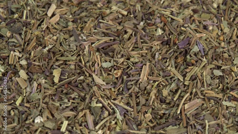 Dried basil spice background rotate. Dry italian seasoning basil. Spices and herbs for cooking Dried basil spice background rotate. Dry italian seasoning basil. Spices and herbs for cooking