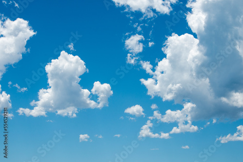 fluffy clouds in blue sky
