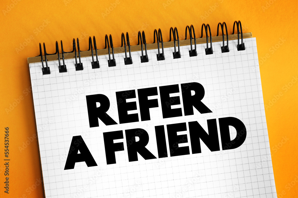 Refer a Friend text on notepad, concept background Refer a Friend text on notepad, concept background