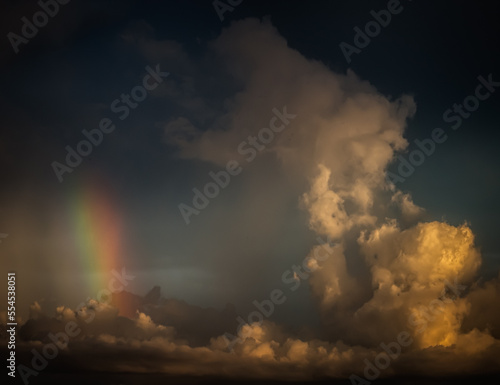 Vertical rainbow within towering cumulus clouds over the Gulf of Mexico, Longboat Key, Sarasota, Florida