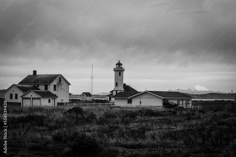 Lighthouse on a stormy day in Port Townsend, Washington with dark gloomy clouds Lighthouse on a stormy day in Port Townsend, Washington with dark gloomy clouds