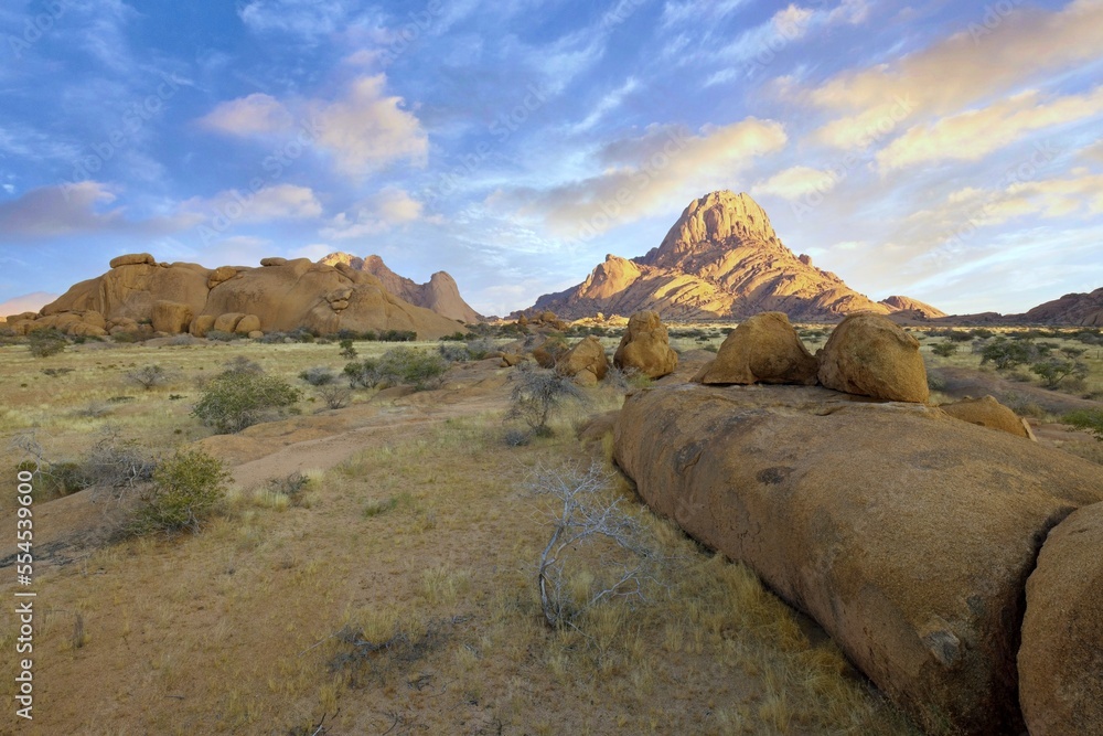 Sunrise in calm morning in Spitzkoppe, panoramic, desert landscape of famous red, granite rocks, Namibia, Africa Sunrise in calm morning in Spitzkoppe, panoramic, desert landscape of famous red, granite rocks, Namibia, Africa