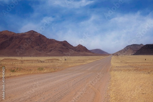 Desert landscape with acacia trees and mountains, NamibRand Nature Reserve, Namib, Namibia, Africa