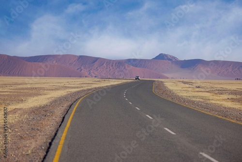 Desert landscape with acacia trees and mountains, NamibRand Nature Reserve, Namib, Namibia, Africa