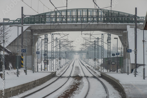 Veseli nad Luznici stop with snowy platforms and road bridge over railway photo