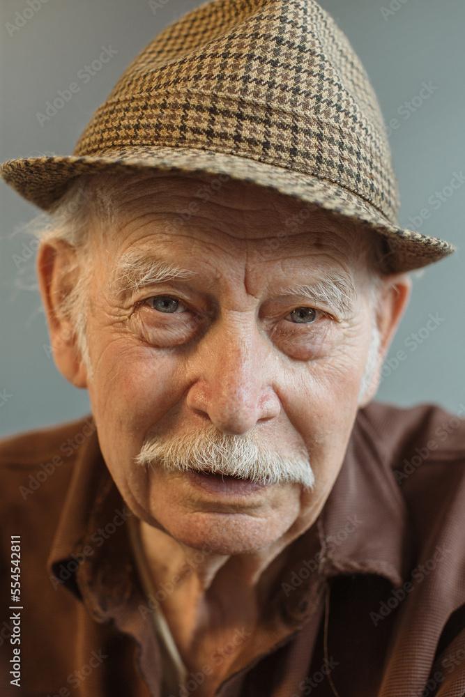 Close up. Thoughtful portrait of a gray-haired old man. Close up. Thoughtful portrait of a gray-haired old man.