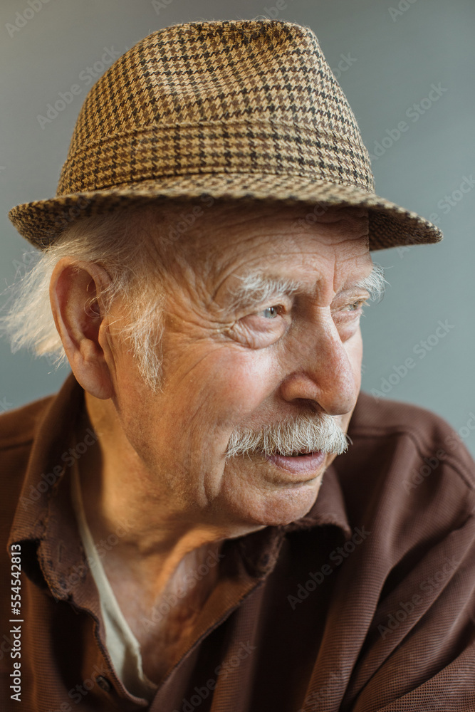 Close up. Thoughtful portrait of a gray-haired old man. Close up. Thoughtful portrait of a gray-haired old man.