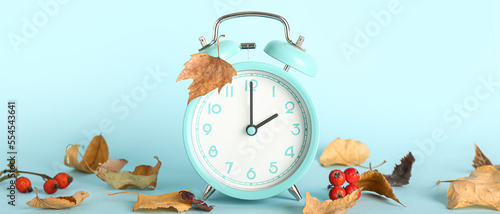 Alarm clock and autumn leav...