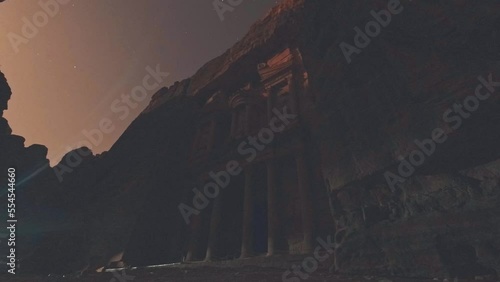 Low angle Time lapse Movie of Petra by Night without candles lighting by moon. Front of The Treasury (Al-Khazneh), elaborate temples in ancient Arab Nabatean Kingdom city of Petra photo