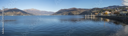 Extra wide angle view of The promenade on the lake in Luino with the mountains in the background © Alessio