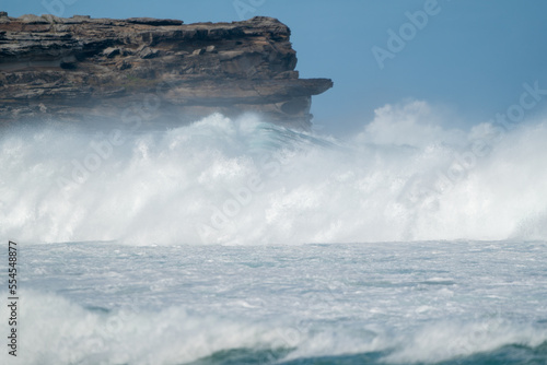 Big waves crashing onto the cliffs during a storm